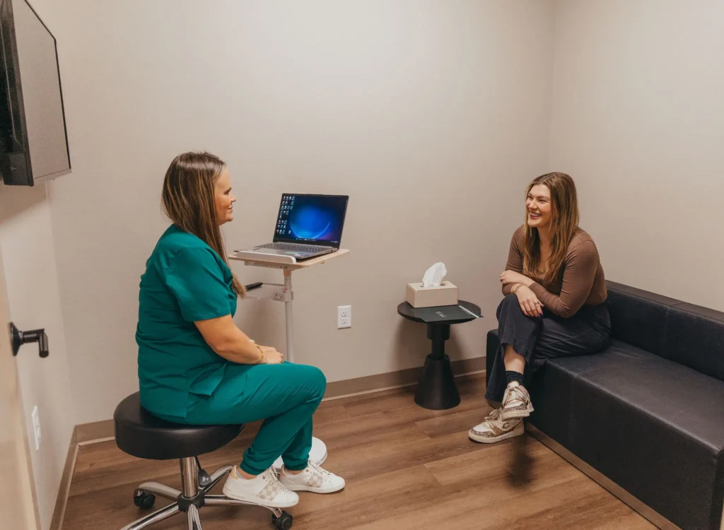 Provider meeting with a client in a private consultation room
