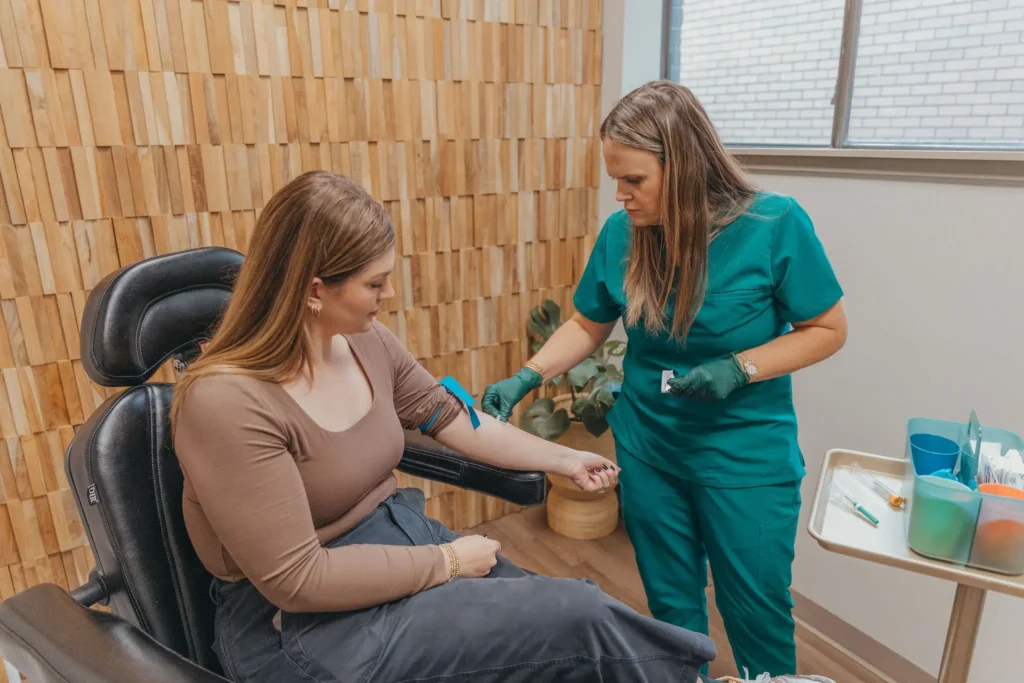 Provider preparing a client for treatment in a treatment chair